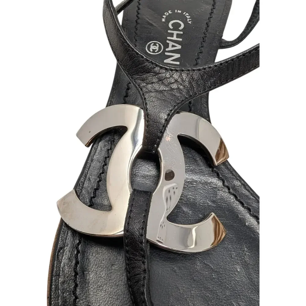 Chanel Big Logo Filigree Thong T-Strap Flat Sandal Black Leather Silver 38 | 7.5